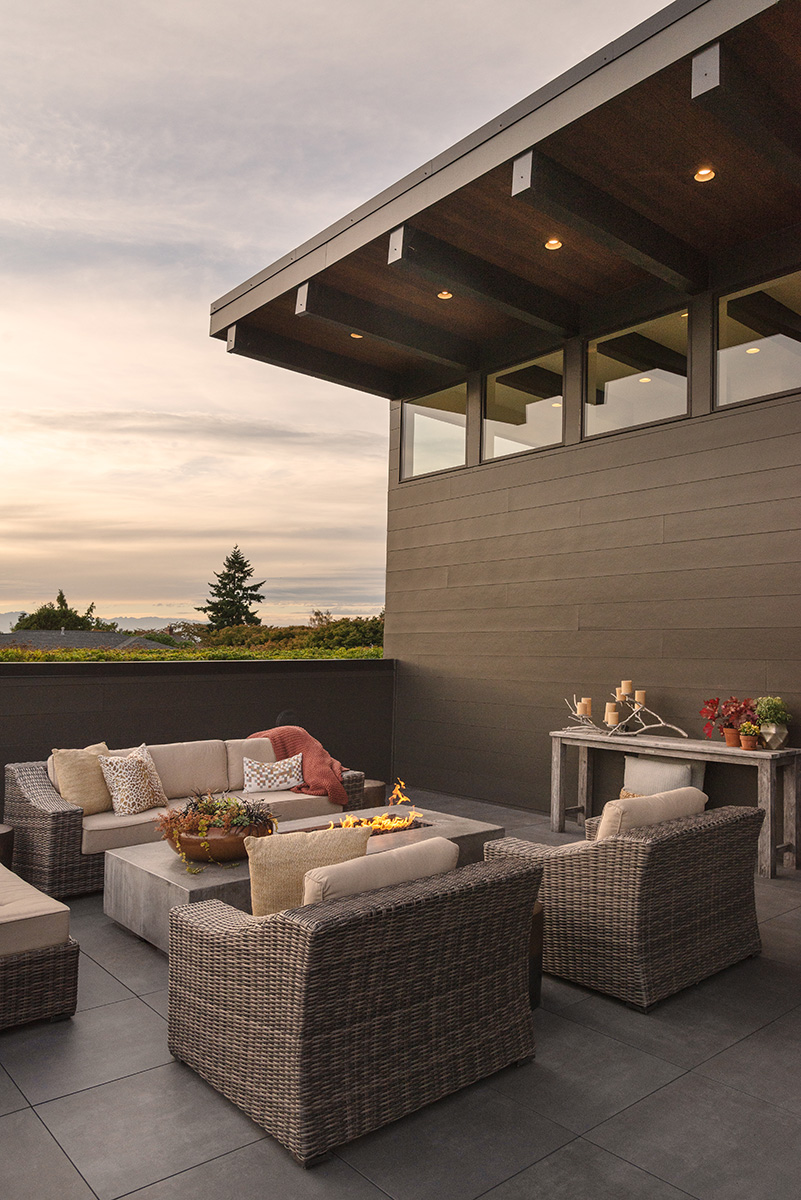 Roof patio with fire at sunset